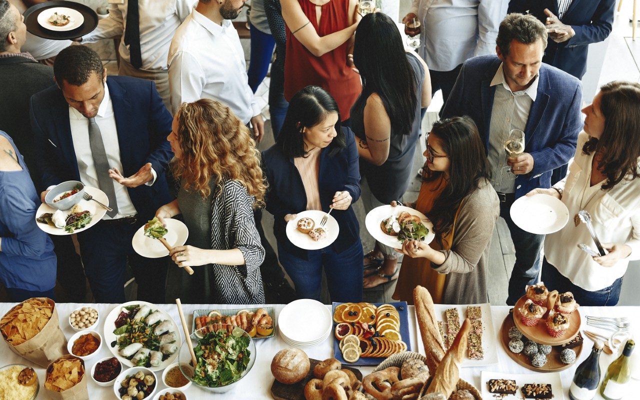 People at a buffet-style social gathering.
