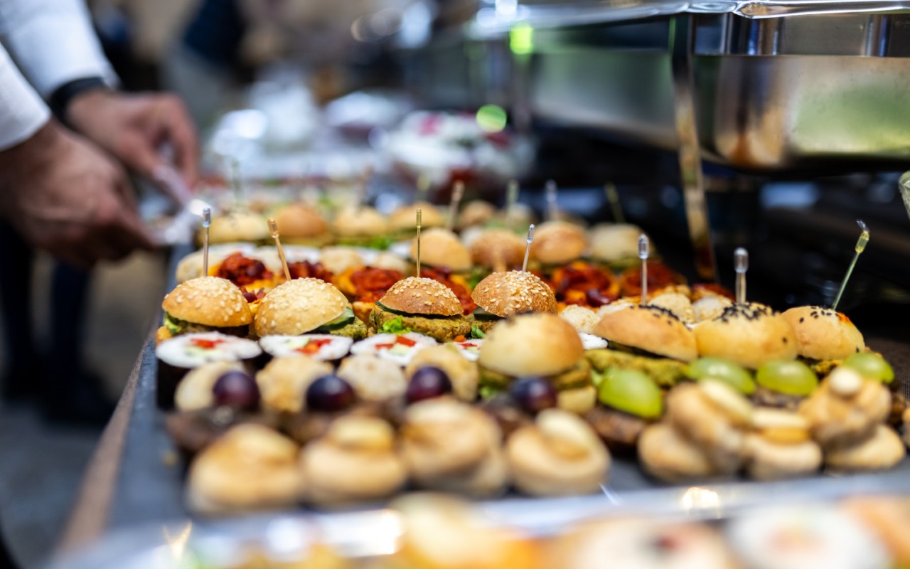 Assorted finger foods on a buffet table.