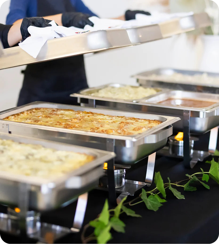 Buffet setup with hot food trays.